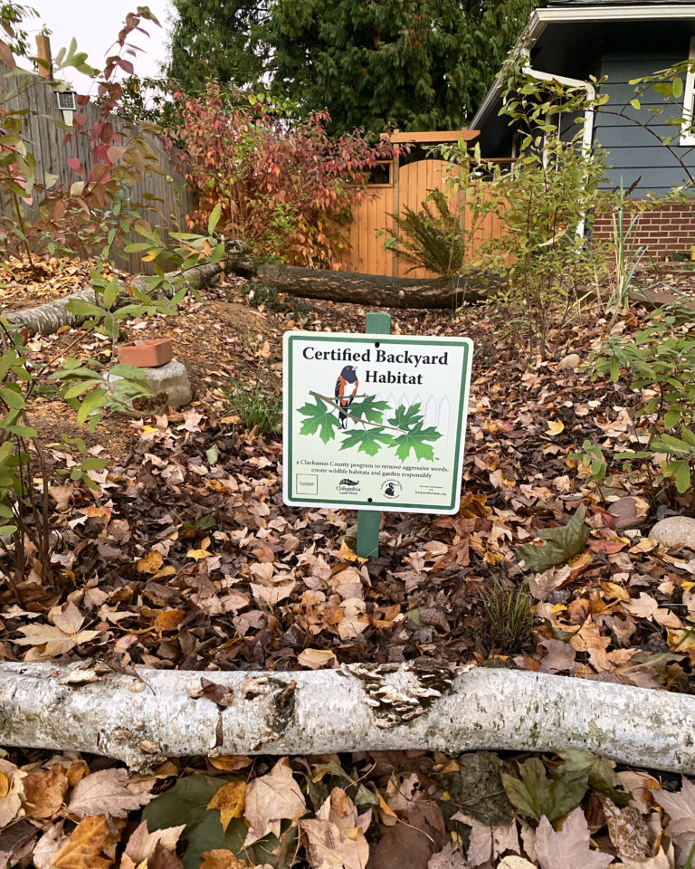 A sign in a garden.